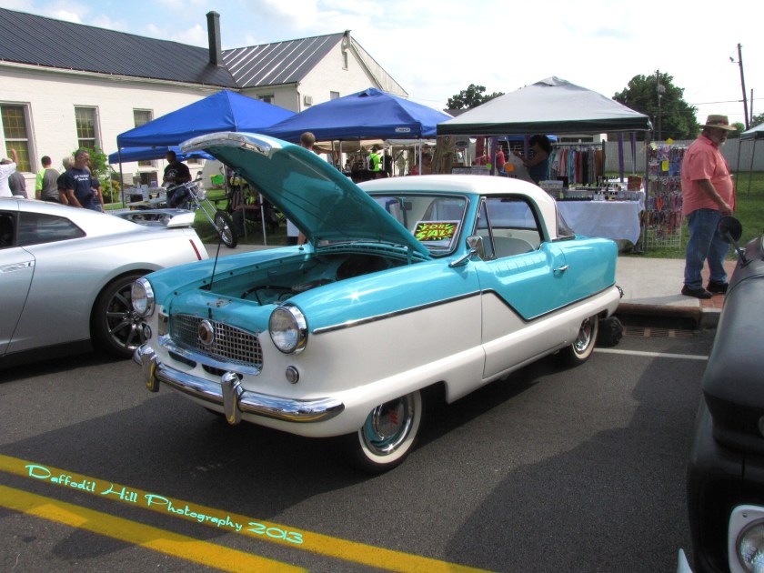 This is a Nash Metropolitan and yes baby blue is still a blue. I had to wear a Tux that color once..shiver.